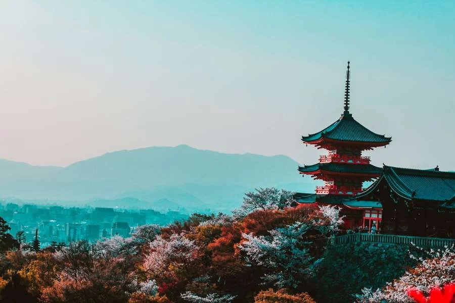 Kyoto, Japan - Red and Black Temple Surrounded by Trees Photo