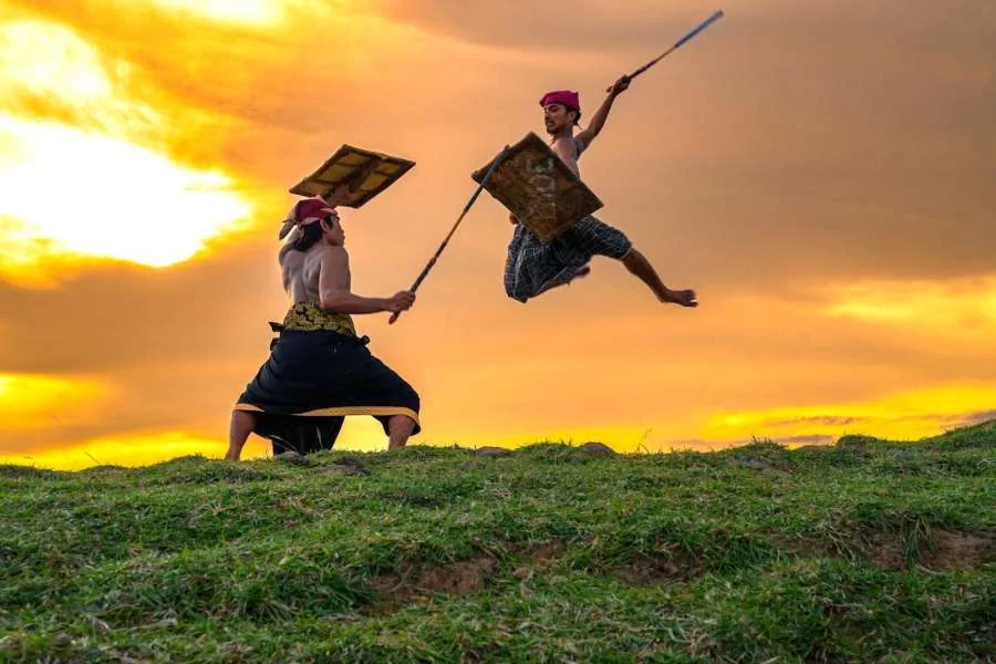 Lombok and the Gili Islands, Indonesia - Traditional Lombok Stick Fighters at Sunset