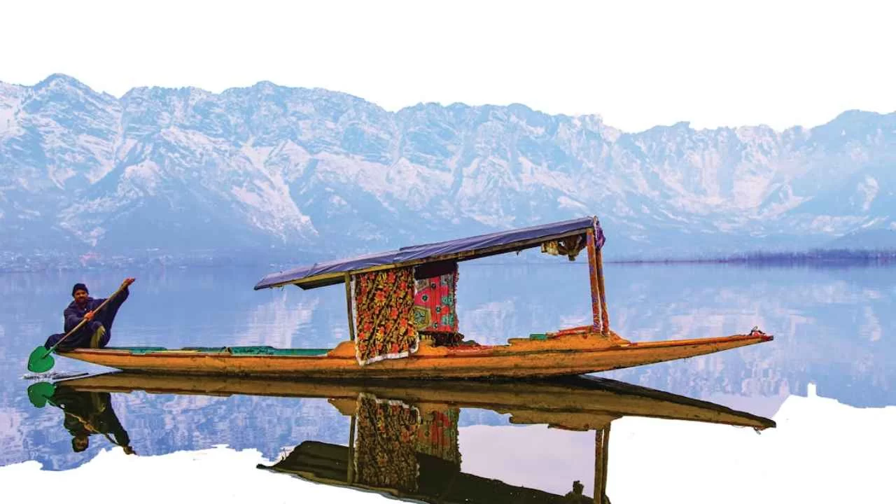 Dal Lake srinagar - man on boat, best place to see in srinagar